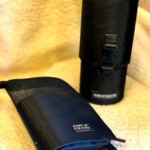 Eyeshadow brush cases. One hard, one soft.